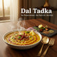 Curriies4u Dal Tadka ready-to-eat meal with fresh spices, served hot in a white bowl on a wooden table.