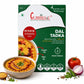 Curriies4u Dal Tadka ready-to-eat meal box with a bowl of yellow lentils, fresh tomato, onion, and spices.